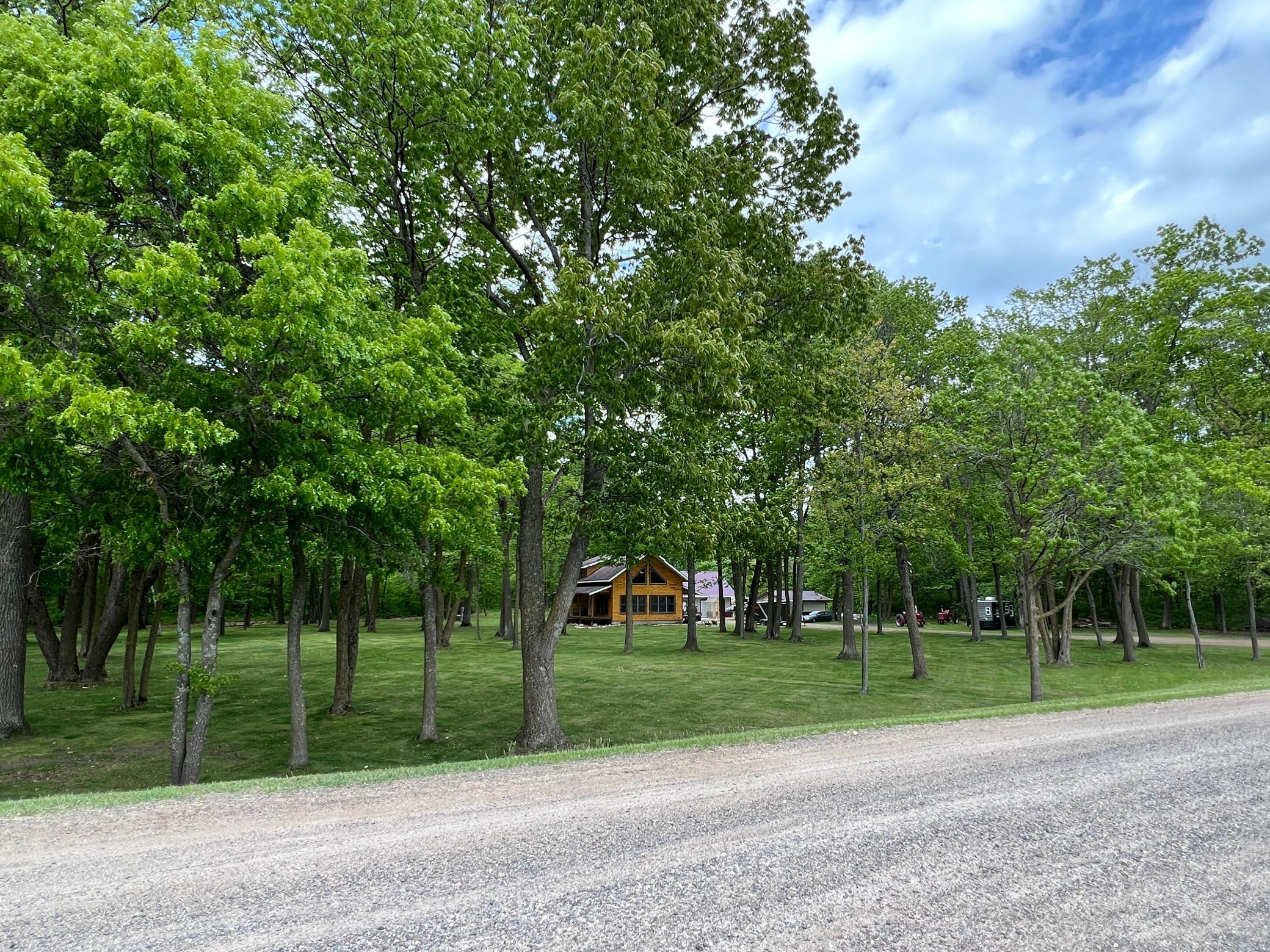Large spacious yard with up North cabin feel and lots of storage and space for the toys.
