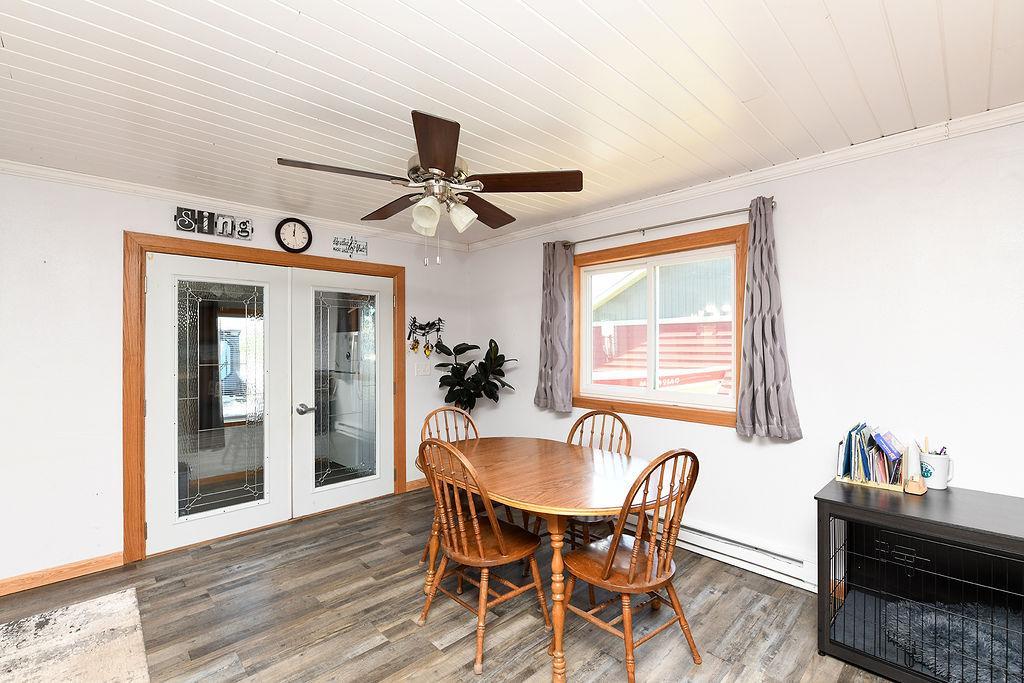 Dining Area With Double Doors That Both Open