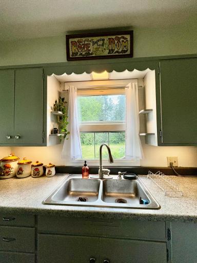Kitchen sink with built in shelves