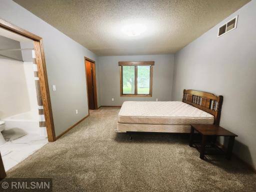 Primary Bedroom 1 with Full Bath and Walk-in Closet.jpg