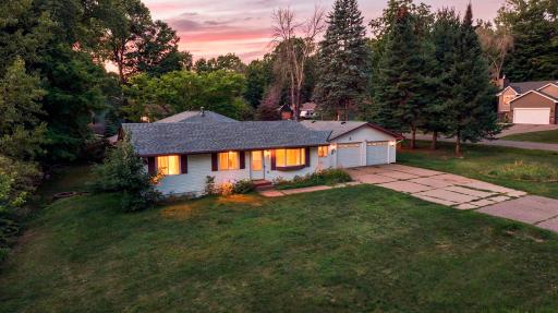 Concrete Driveway with brick accent edging and brick sidewalk to front door and breezeway