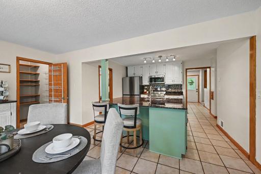 Kitchen and Informal Dining space featuring a pantry space.