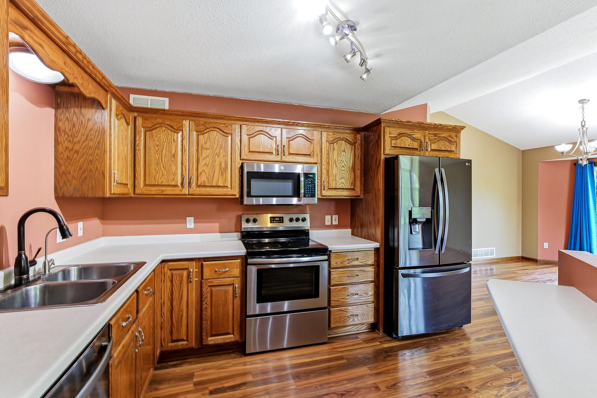 Well-equipped kitchen featuring stainless steel appliances, plentiful cabinet storage provide both style and practicality for every day living. Open layout that flows seamlessly into the main living areas.
