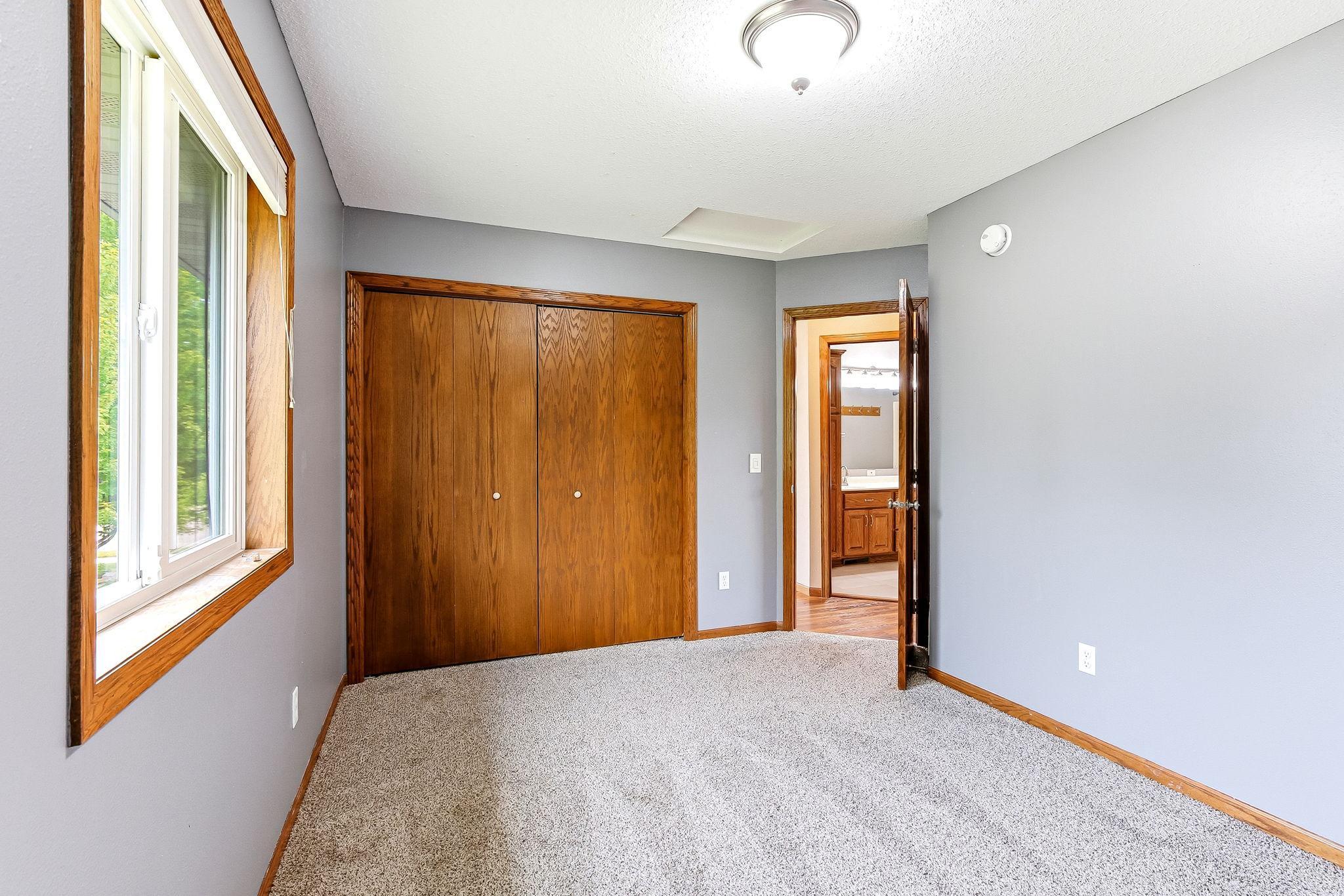Neutral finishes and a functional layout create a comfortable space that's perfect for family, guests, or a home office.