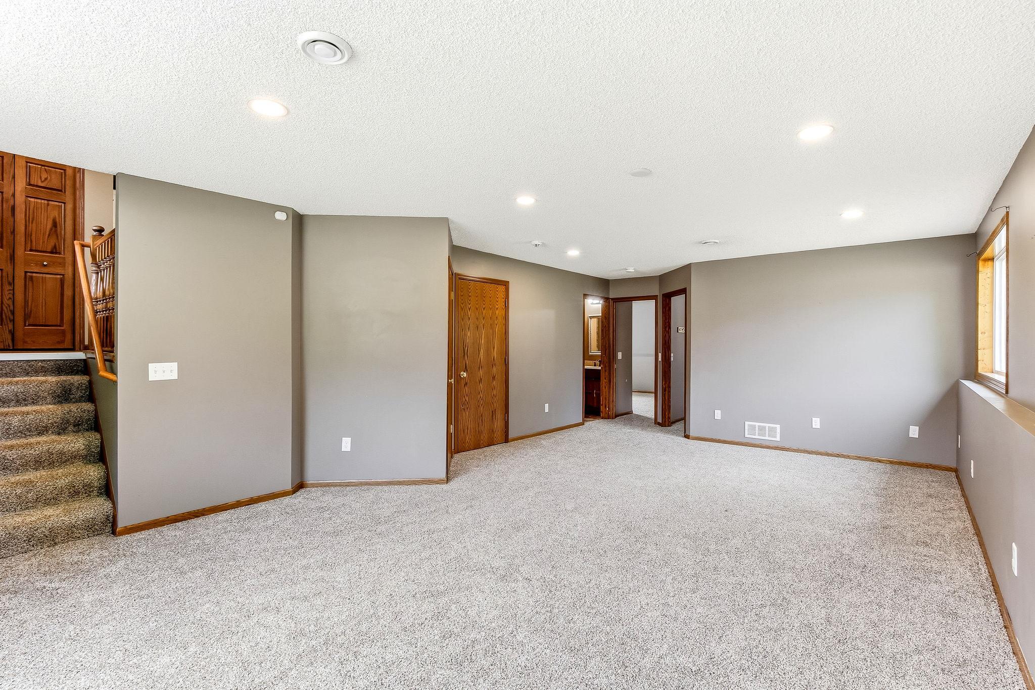 The expansive layout offers endless possibilities for movie nights, game days, hobbies, or a comfortable gathering space.