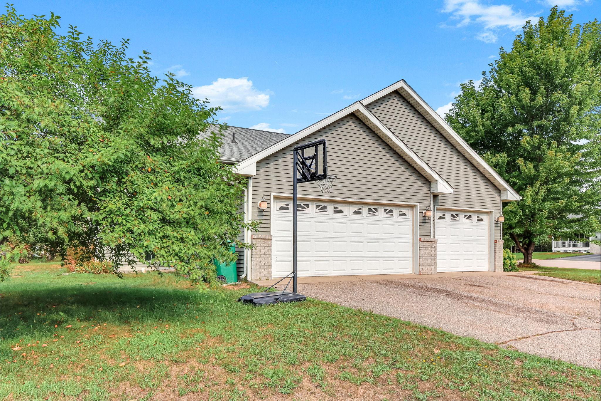 3 car garage and large driveway for a fun time shooting baskets.