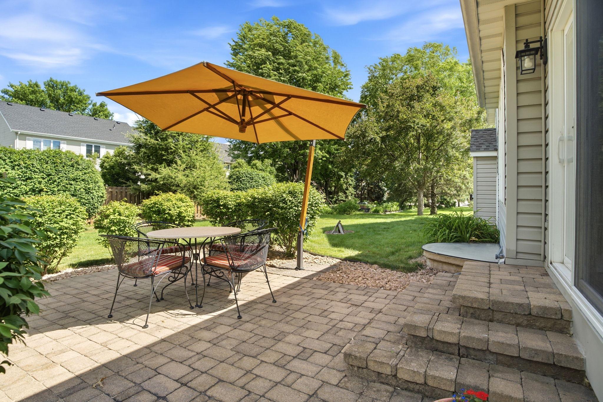 Paver patio with privacy bushes surrounding