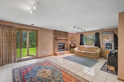 Basement family room with wood burning fireplace for the cozy MN winters.