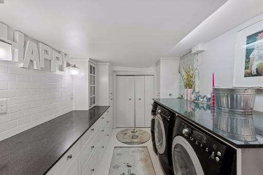 A true standout feature is the one-of-a-kind finished laundry room.