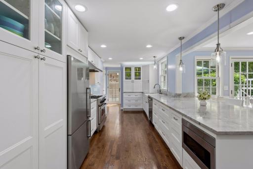 The kitchen is bathed in abundant natural light.