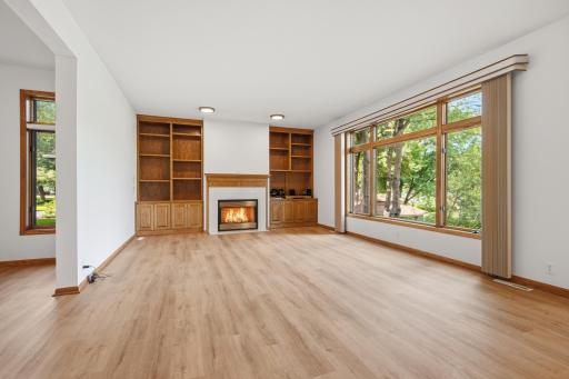 Oversized main floor family room with built-ins and fireplace