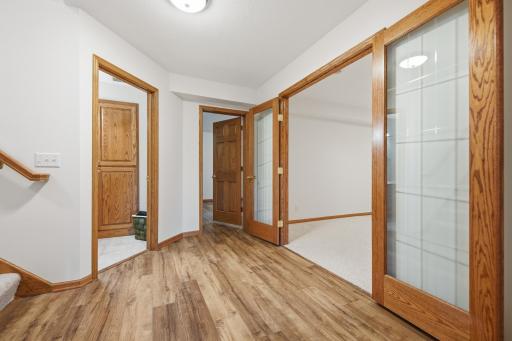 French doors to extra non-conforming bedroom on lower level.