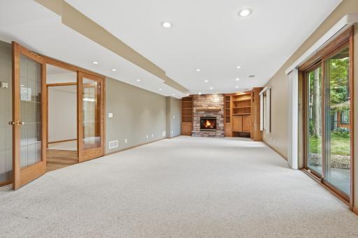 Lower level family room with beautiful French doors and slider to backyard