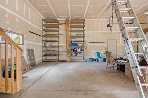 Shelving stays with home. Notice ladder to attic access....MORE STORAGE!