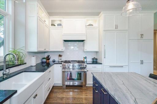 Custom cabinets with Thermador professional appliances, farmhouse sink and soapstone counters