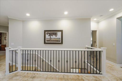 The main floor Primary bedroom sits opposite the living and dining space