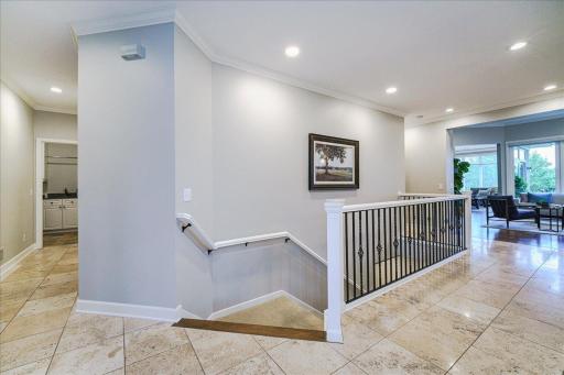 The open staircase leads to your walk-out lower level