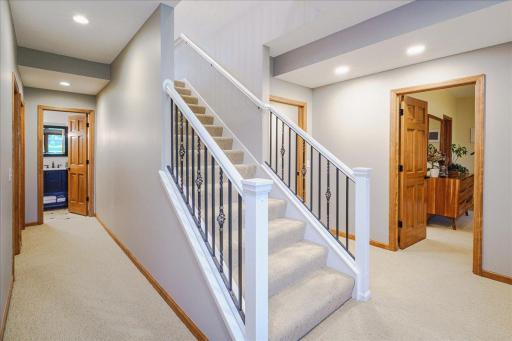 Two additional bedrooms sit on either side of the staircase