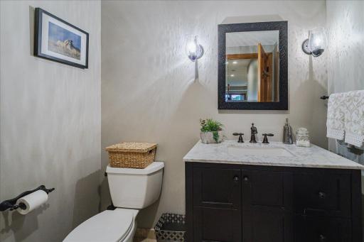Lower level 3/4 bath with fully tiled shower and bench