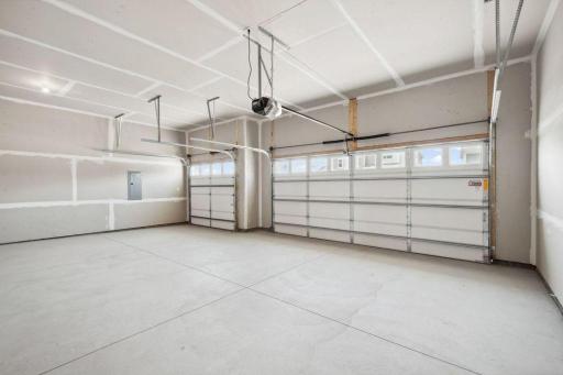 A 3-car garage is perfect for hobbies, toys or...a golf simulator?! Model photo, options and colors may vary.