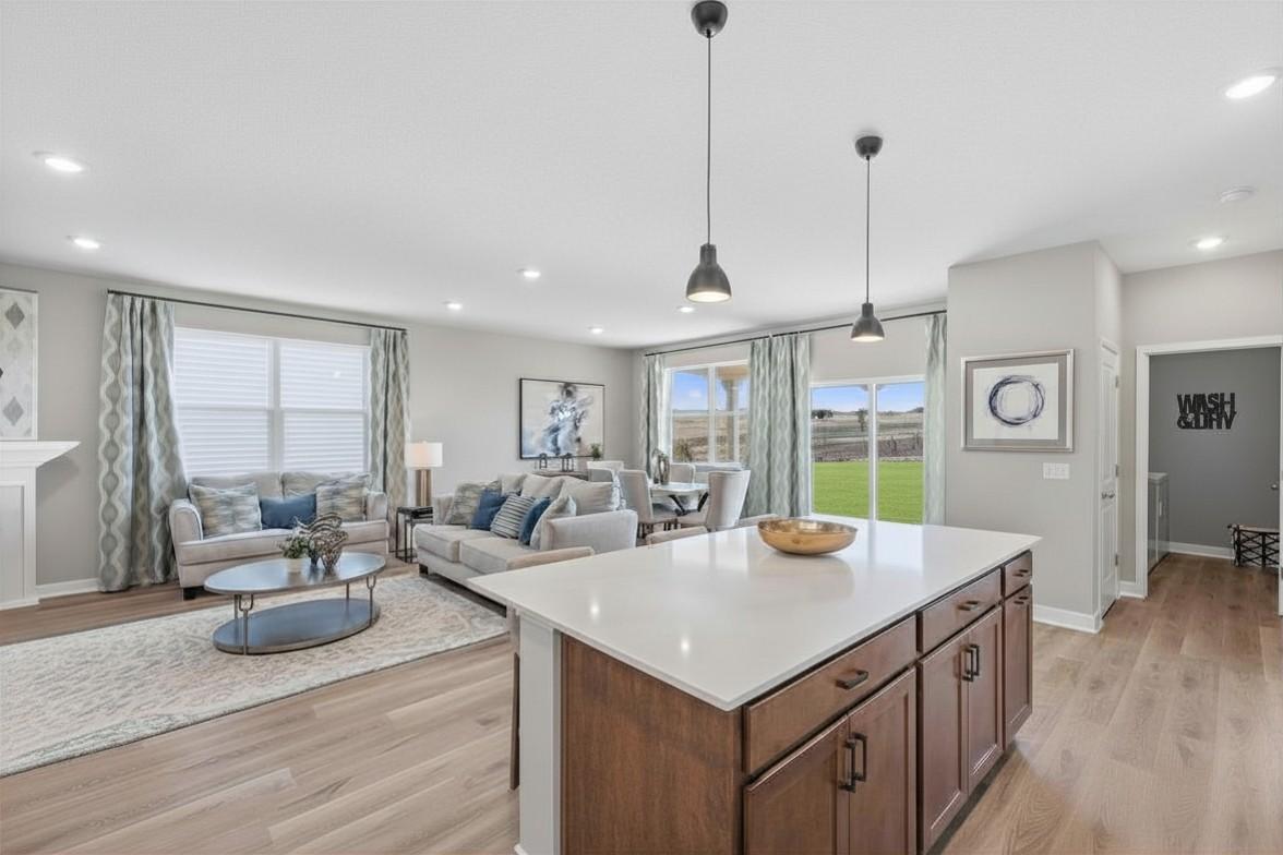 Windows, 9-foot knockdown ceilings and inviting openness enriches the living spaces! Model photo, options and colors may vary.