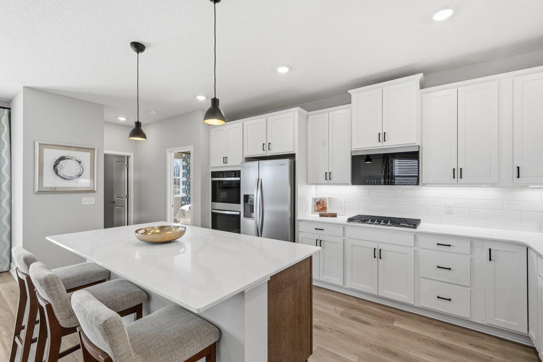 Light and spacious kitchen with Whirpool appliances. Model photo, options and colors may vary.
