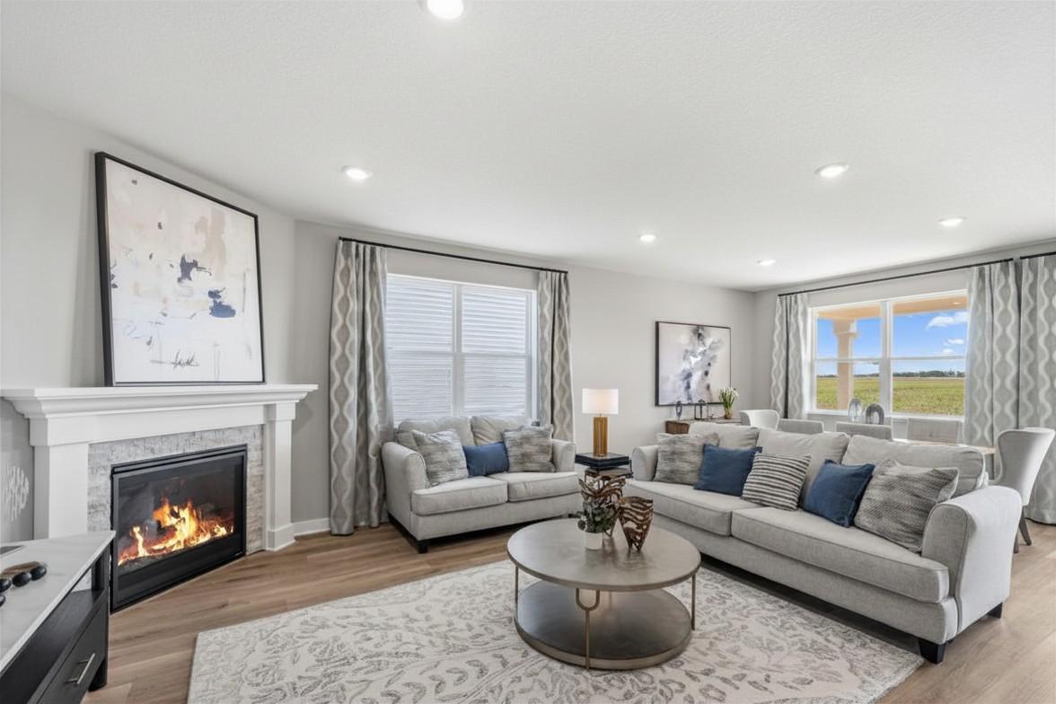 A gas fireplace adds ambiance to your gathering room. Model photo, options and colors may vary.