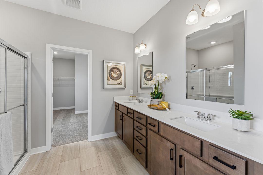 En-suite primary bathroom. Model photo, options and colors may vary.