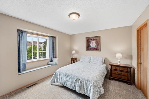 Primary bedroom features two closets for exceptional storage.