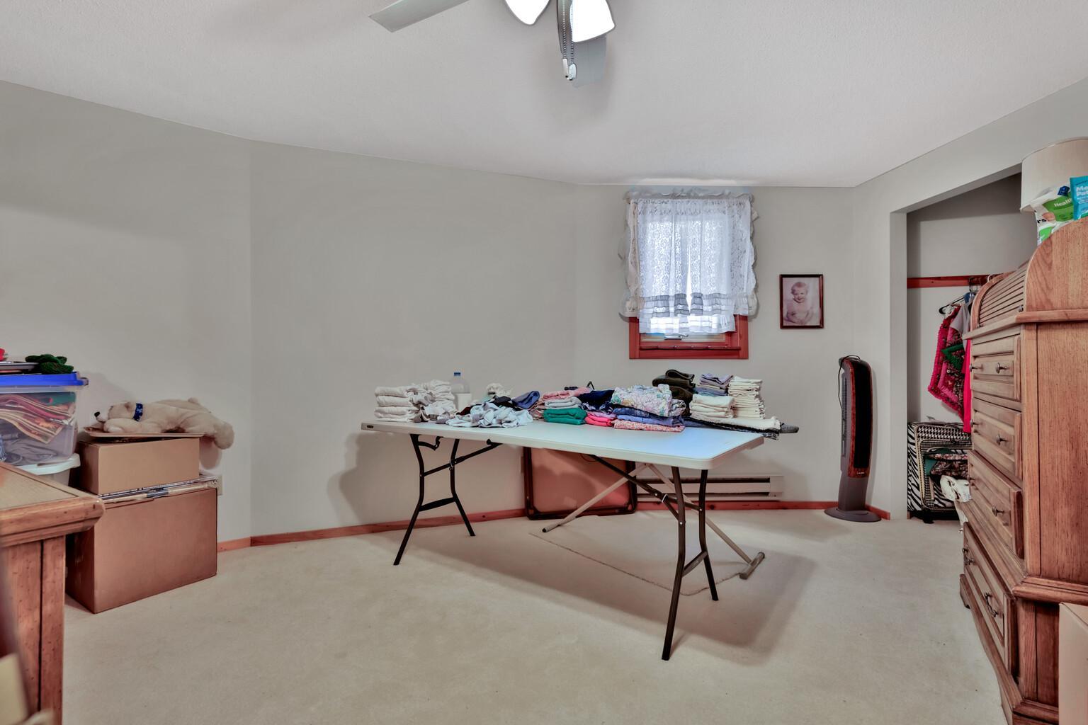 Bedroom is being used as a craft room.