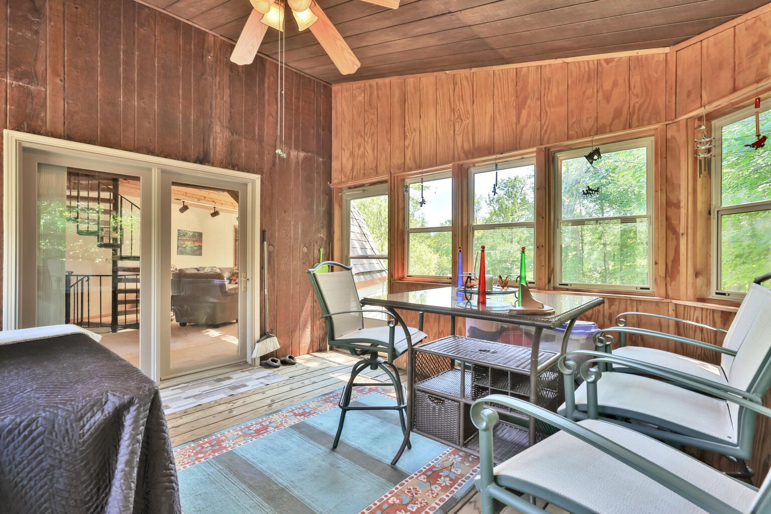 Enjoy the beaty and privacy of the lot from the three season porch.