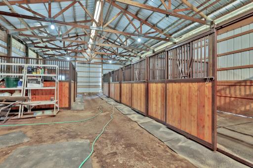 The barn includes a tack room and six stalls.