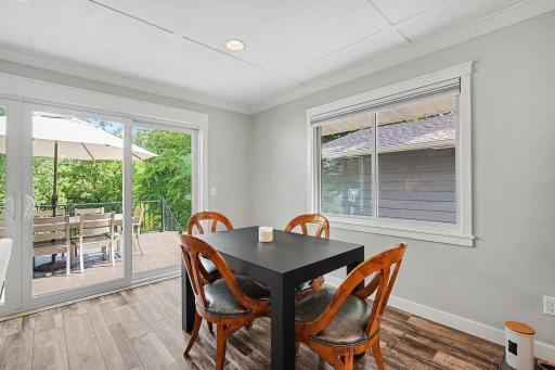 Informal dining room right off the kitchen leading to the deck - Open concept to living room: Main-level