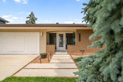Timelss mid-century charm with modern comfort in St. Anthony!