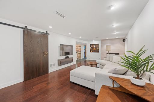 The lower level is made for entertaining with a family room, corner fireplace & built-in bar!