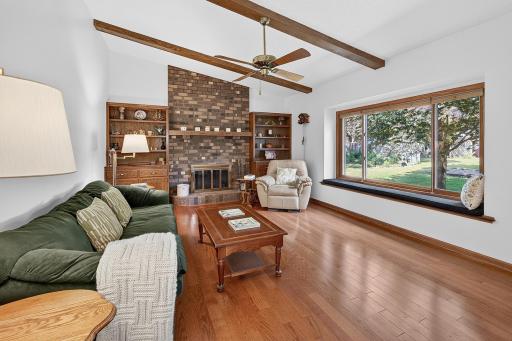 Main floor family room with vaulted ceiling and brick fireplace.