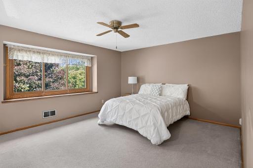 Spacious owner's bedroom with private bath and walk-in closet.