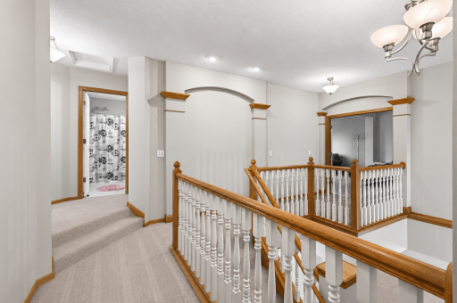 Upper level wrap-around catwalk with elevated bedroom landing