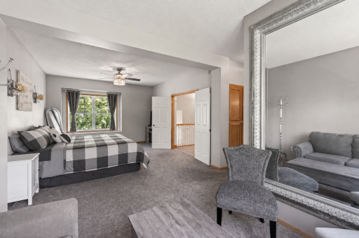 Private primary suite featuring a versatile sitting/office/nursery area