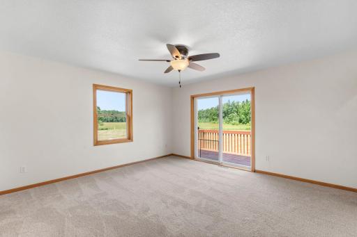 Private deck access from the primary bedroom
