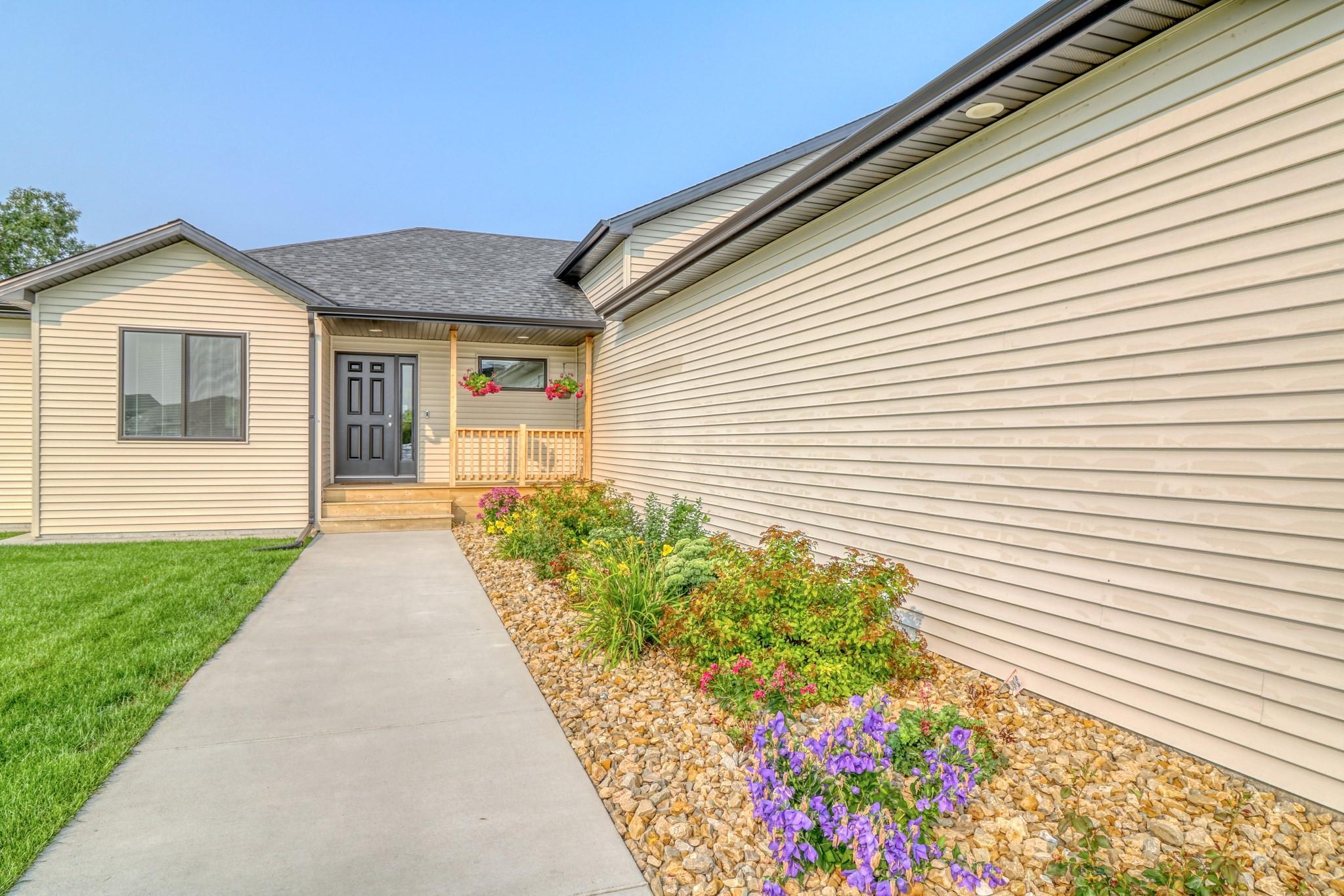 Front w/beautiful landscaping
