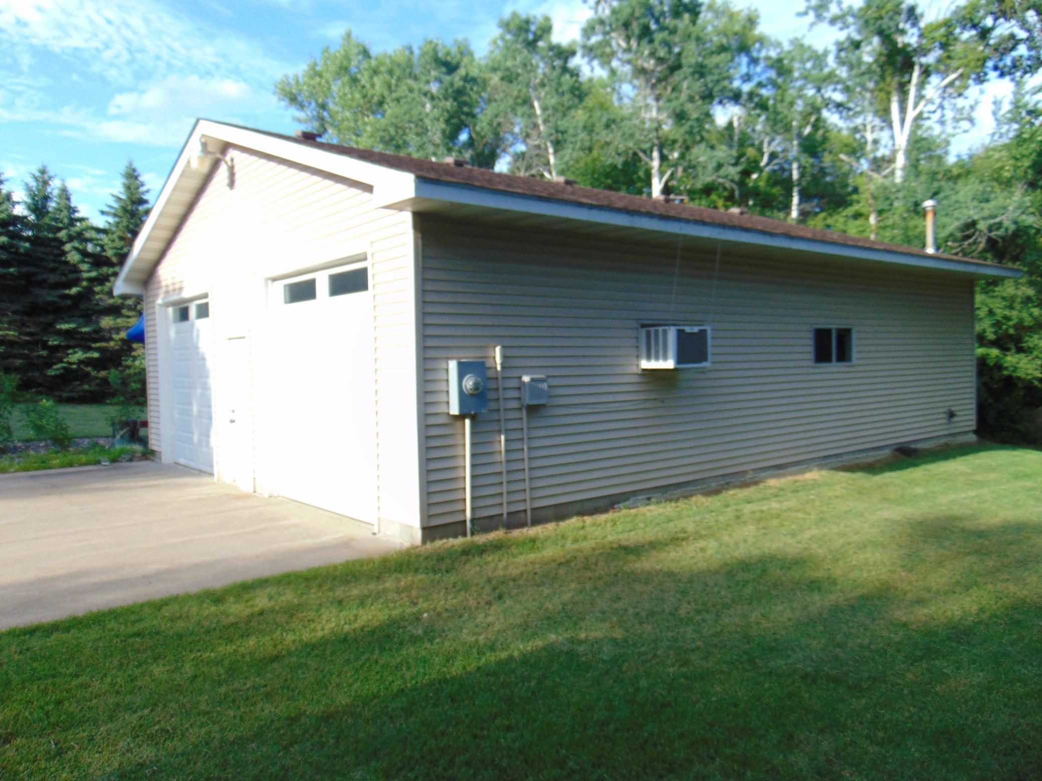 Insulated 30x40 detached garage with heat, A/C and power for your workshop has 9'x9' doors.