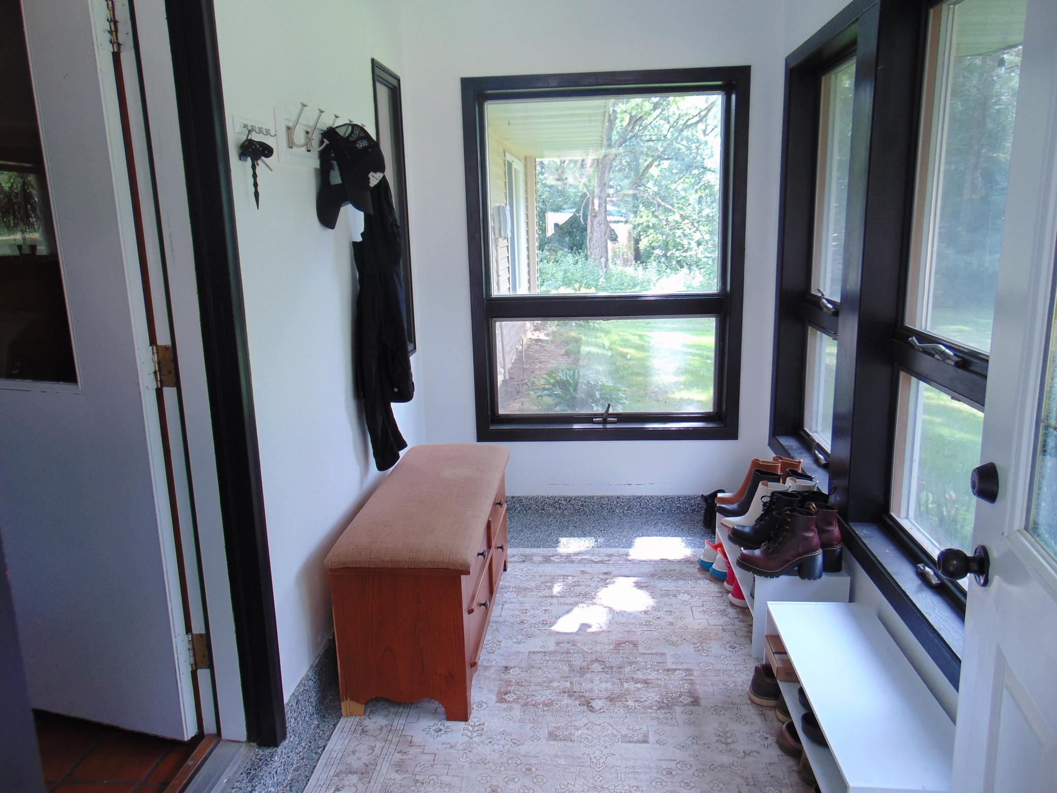 Enter home through welcoming porch/sunroom.