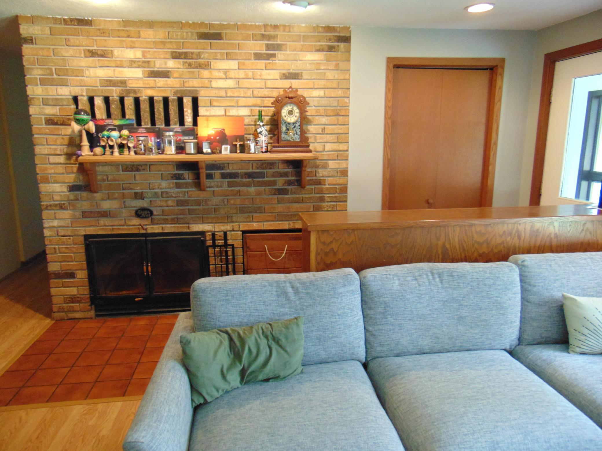Woodburning fireplace in living room.