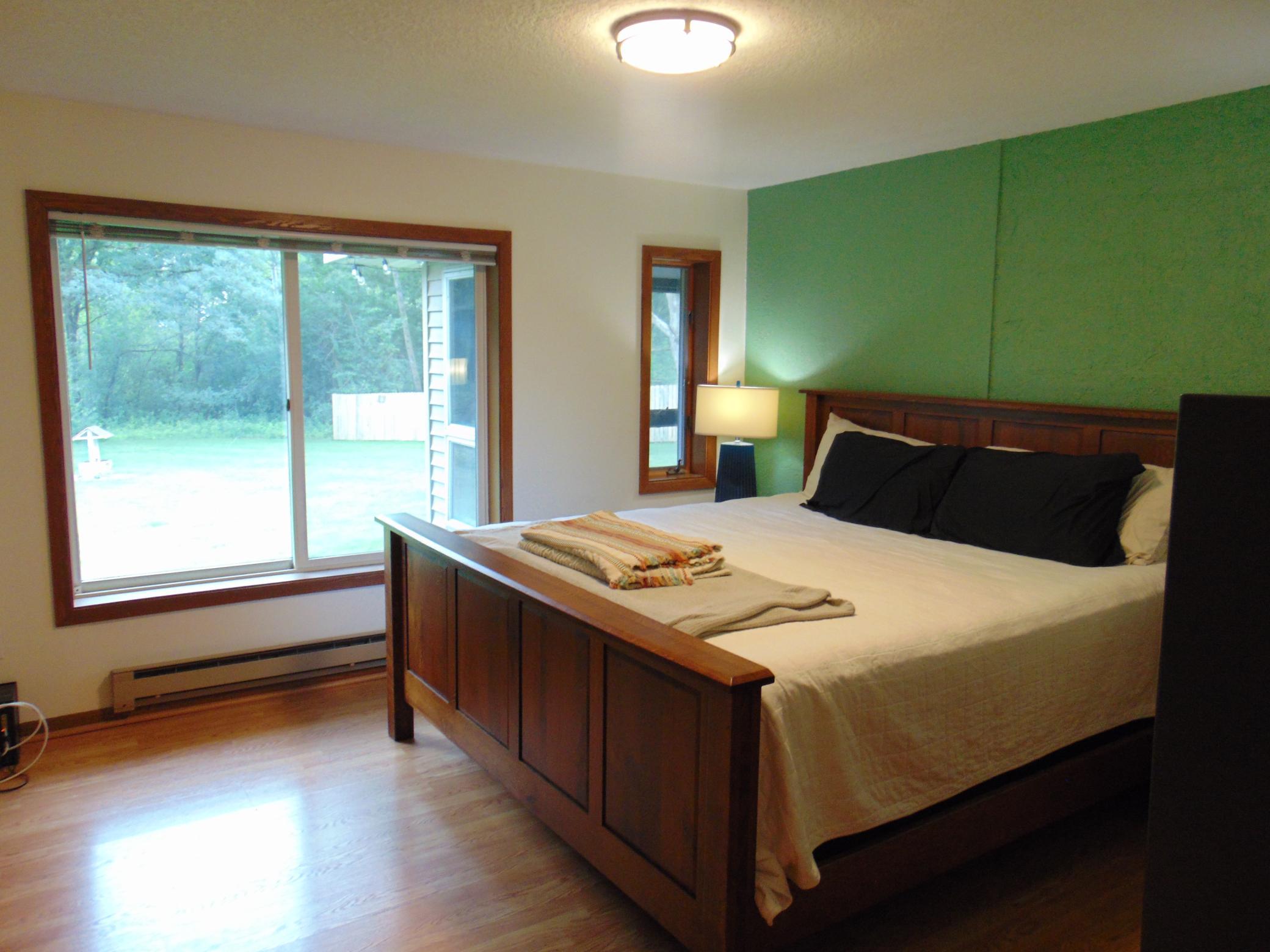 Master bedroom with outdoor views.