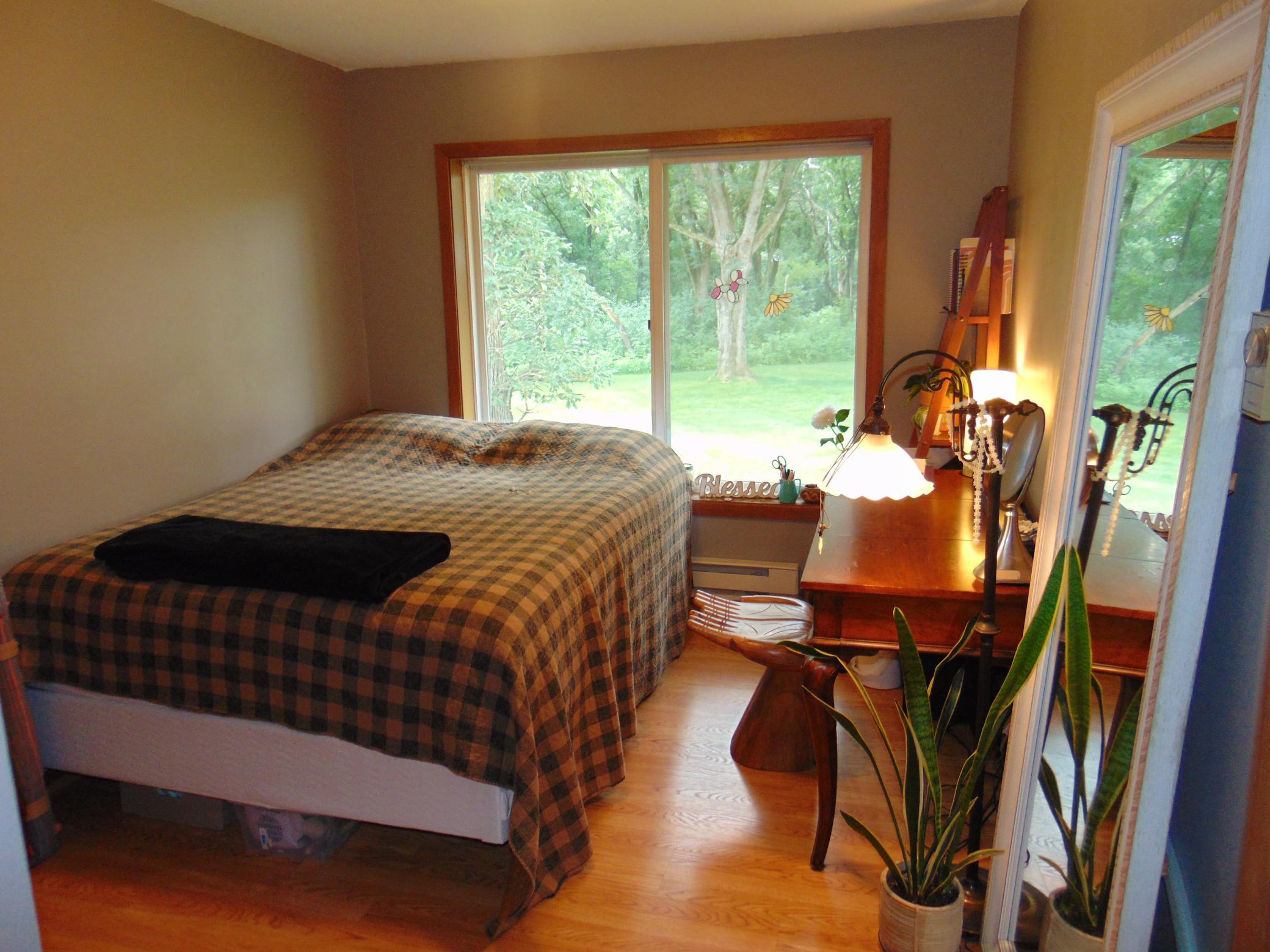 Second bedroom with outdoor view.