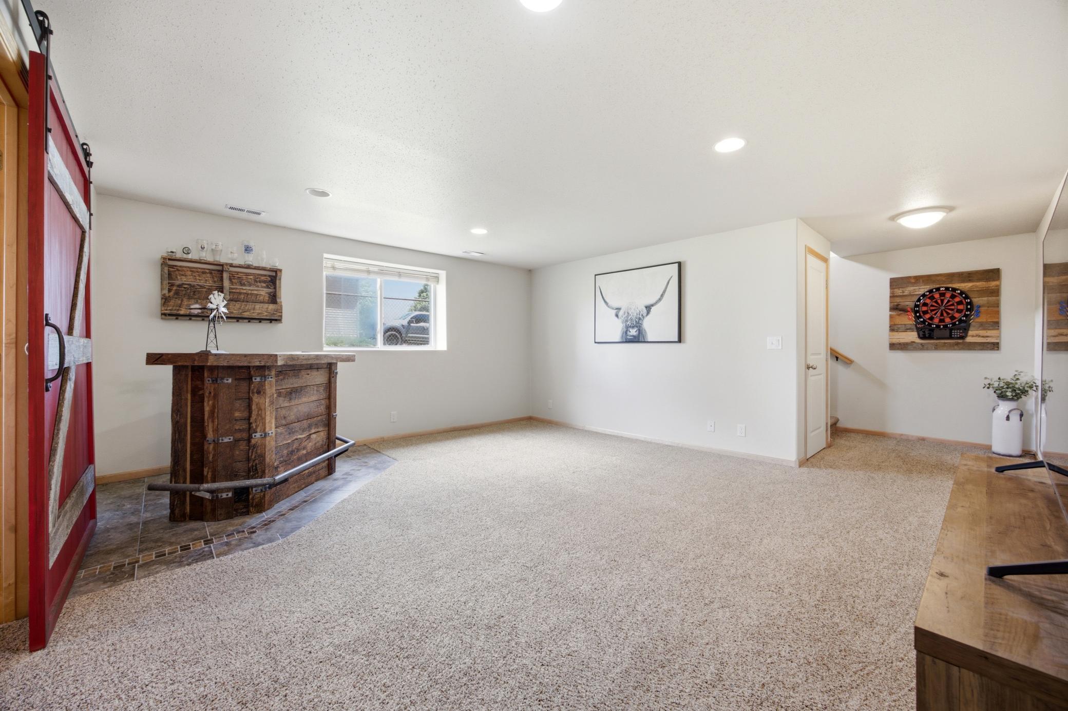 Lower family room with built in bar