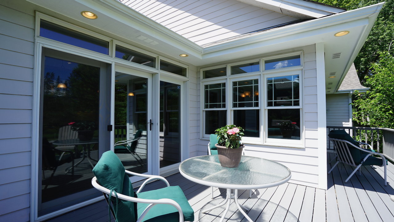 The expansive deck provides the perfect vantage point for morning coffee or evening gatherings under the stars.