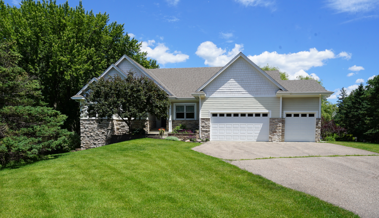 Welcome to your own private reserve in Shorewood. Set on a gentle rise above nearly an acre of manicured lawn, this walk-out rambler offers a quiet, preserve-like lifestyle perfectly tailored for seamless indoor-outdoor living in Minnetonka Schools.