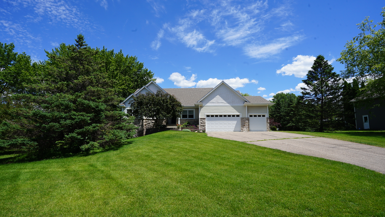 Welcome to your own private reserve in Shorewood. Set on a gentle rise above nearly an acre of manicured lawn, this walk-out rambler offers a quiet, preserve-like lifestyle perfectly tailored for seamless indoor-outdoor living in Minnetonka Schools.